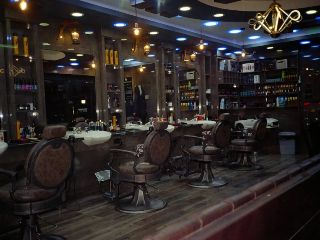 Barbershop interior with classic chairs and lit shelves